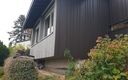 Isolation thermique en façade finition joint debout aluminium et bardage douglas pré-grisé